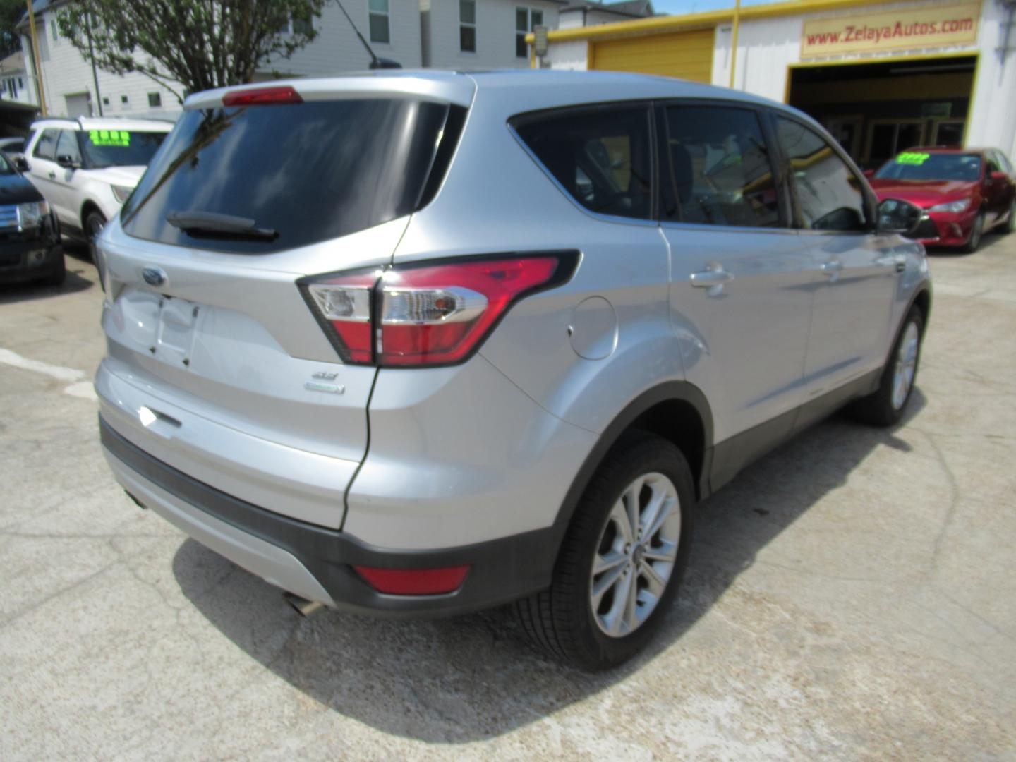 2017 Silver /Black Ford Escape SE FWD (1FMCU0GDXHU) with an 1.5L L4 DOHC 16V engine, Automatic transmission, located at 1511 North Shepherd Dr., Houston, TX, 77008, (281) 657-1221, 29.798361, -95.412560 - 2017 FORD ESCAPE SE VIN: 1FMCU0GDXHUE54105 1 F M C U 0 G D X H U E 5 4 1 0 5 4 DOOR WAGON/SPORT UTILITY 1.5L I4 F DOHC 16V GASOLINE FRONT WHEEL DRIVE - Photo#16